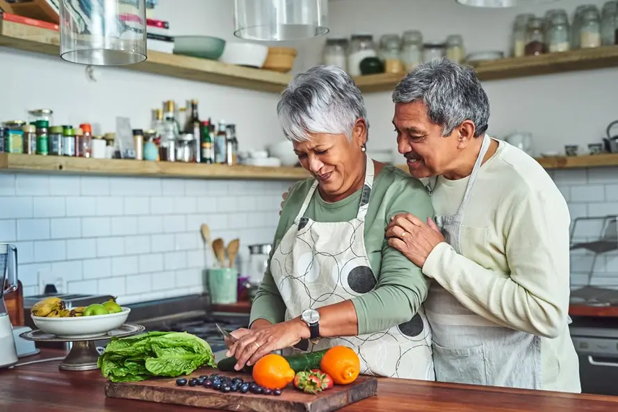 Shot of a older adult couple cooking a healthy meal at home